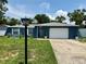 Charming single-story home with a well-maintained lawn and a classic blue exterior at 2270 Amherst Ave, Spring Hill, FL 34609