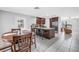 Bright, open kitchen boasts granite counters, stainless appliances, and seamless flow to the dining and living areas at 2270 Amherst Ave, Spring Hill, FL 34609