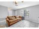 Inviting living room with a ceiling fan, natural light, and tile flooring at 2270 Amherst Ave, Spring Hill, FL 34609