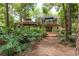 Beautiful backyard featuring a gazebo, mature trees, a balcony and patio at 2279 Ranchette Ln, Dunedin, FL 34698