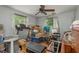 Messy bedroom with packed boxes, treadmill and other workout equipment at 2279 Ranchette Ln, Dunedin, FL 34698