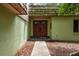 Charming front entryway with unique architectural details at 2279 Ranchette Ln, Dunedin, FL 34698