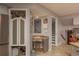 Hallway featuring granite countertops, and access to the adjacent staircase at 2279 Ranchette Ln, Dunedin, FL 34698
