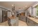 Modern kitchen with stainless steel appliances, granite countertops, and ample cabinet space at 2279 Ranchette Ln, Dunedin, FL 34698