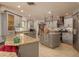 Well-equipped kitchen with granite countertops, stainless steel appliances, and an island with storage at 2279 Ranchette Ln, Dunedin, FL 34698