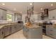 Modern kitchen with granite countertops, stainless steel appliances, and ample cabinet space at 2279 Ranchette Ln, Dunedin, FL 34698