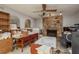 Office with stone fireplace, wood floors, with an adjacent workstation at 2279 Ranchette Ln, Dunedin, FL 34698