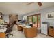 Spacious office with fireplace, wood floors, and an adjacent sunroom at 2279 Ranchette Ln, Dunedin, FL 34698
