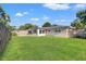 Expansive backyard showcasing a well-manicured lawn and fenced perimeter, providing a private and serene outdoor space at 2701 65Th Ave S, St Petersburg, FL 33712