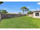Well-maintained backyard with lush green grass and a privacy fence, offering a peaceful and secluded outdoor space at 2701 65Th Ave S, St Petersburg, FL 33712
