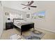 Comfortable bedroom with ceiling fan and natural light from two windows at 2701 65Th Ave S, St Petersburg, FL 33712