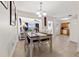 Bright dining area with a wooden table and seating for four, with views into the living room and kitchen, creating an open flow at 2701 65Th Ave S, St Petersburg, FL 33712