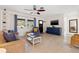 Comfortable living room features tile floors, natural light from the window, and a neutral color scheme, creating a cozy atmosphere at 2701 65Th Ave S, St Petersburg, FL 33712