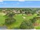 Scenic aerial view of a neighborhood bordering a lush green golf course, showcasing the community layout at 2713 Brianholly Dr, Valrico, FL 33596