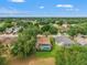 Aerial view of backyard featuring fenced-in pool and mature trees at 2713 Brianholly Dr, Valrico, FL 33596