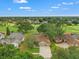 Aerial view of house with nice landscaping, golf course in the background at 2713 Brianholly Dr, Valrico, FL 33596