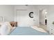 Bright bedroom featuring wood-look floors, closet and ensuite bathroom access at 2713 Brianholly Dr, Valrico, FL 33596