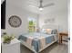 Cozy bedroom with a ceiling fan, large window, and stylish decor at 2713 Brianholly Dr, Valrico, FL 33596
