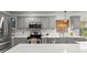 Modern kitchen with stainless steel appliances, sleek countertops, and ample cabinet space at 2713 Brianholly Dr, Valrico, FL 33596