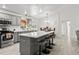 Spacious kitchen with an island, bar seating, and adjacent dining area at 2713 Brianholly Dr, Valrico, FL 33596