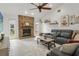 Cozy living room with a brick fireplace, plush seating, and plenty of natural light at 2713 Brianholly Dr, Valrico, FL 33596