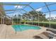 Screened pool with backyard views on sunny day, featuring tanning deck at 2713 Brianholly Dr, Valrico, FL 33596