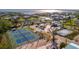 Community aerial view featuring tennis courts and more enhancing the neighborhood's appeal at 28 Seaside Ct, Holmes Beach, FL 34217