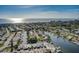 Scenic aerial view of waterfront homes along canals leading to the ocean under a clear blue sky at 28 Seaside Ct, Holmes Beach, FL 34217
