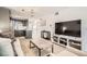 Open-concept living area featuring a modern kitchen and comfortable seating with a TV at 28 Seaside Ct, Holmes Beach, FL 34217