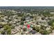 Neighborhood aerial featuring the property with surrounding residences, lush trees, and quiet streets at 3104 Apricot St, Seffner, FL 33584