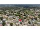 An aerial view of a suburban neighborhood with mature trees and well-maintained homes at 3104 Apricot St, Seffner, FL 33584