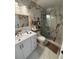 Bathroom features a shower with marble surround, vanity and mirror at 3104 Apricot St, Seffner, FL 33584
