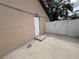 Exterior view of the home with a side entrance and concrete patio area at 3104 Apricot St, Seffner, FL 33584