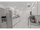 Bright modern kitchen with stainless steel appliances, granite counters, and white cabinetry at 3104 Apricot St, Seffner, FL 33584
