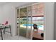 View from inside the home out to the covered patio and screened-in pool at 3104 Apricot St, Seffner, FL 33584