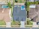 A bird's eye view shows the home's layout, pool, landscaping, and how it fits into the neighborhood at 332 Wood Dove Ave, Tarpon Springs, FL 34689