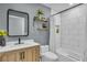 Updated bathroom featuring a single vanity, modern fixtures, and a shower-tub combination with white subway tile at 332 Wood Dove Ave, Tarpon Springs, FL 34689