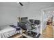 Spacious bedroom with wood floors, desk, and a view, ideal for work and relaxation at 332 Wood Dove Ave, Tarpon Springs, FL 34689