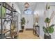 Inviting home foyer with modern decor, stylish light fixtures, and tiled flooring at 332 Wood Dove Ave, Tarpon Springs, FL 34689