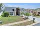 Charming single-story home featuring a well-manicured lawn and inviting curb appeal at 332 Wood Dove Ave, Tarpon Springs, FL 34689