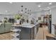 Open kitchen featuring a large island, sleek countertops, and seamless flow into the living spaces at 332 Wood Dove Ave, Tarpon Springs, FL 34689