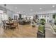 Spacious living area with updated flooring, a modern kitchen, and comfortable seating arrangements at 332 Wood Dove Ave, Tarpon Springs, FL 34689