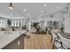 Spacious living space with hardwood floors, white walls, and a view of the living and dining areas at 332 Wood Dove Ave, Tarpon Springs, FL 34689
