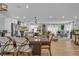 Bright open floor plan features a modern kitchen leading to a dining area and living room at 332 Wood Dove Ave, Tarpon Springs, FL 34689