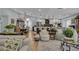 Open-concept living space with a kitchen, dining area, and living room with hardwood floors at 332 Wood Dove Ave, Tarpon Springs, FL 34689