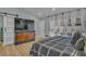 Bright bedroom with view of the pool, large dresser, and curtains allowing natural light to flow in at 332 Wood Dove Ave, Tarpon Springs, FL 34689