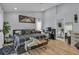 Spacious main bedroom with a desk, ensuite bathroom, light wood floors, and lots of natural light at 332 Wood Dove Ave, Tarpon Springs, FL 34689