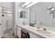 Bathroom features double sinks, lots of counter space, and a shower with glass doors at 35229 Janine Dr, Zephyrhills, FL 33541