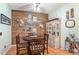 Well-decorated dining room with wood paneling, charming decor, and a cozy atmosphere for Gathering gatherings at 35229 Janine Dr, Zephyrhills, FL 33541