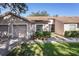 Charming single-story home featuring a one-car garage, well-maintained landscaping, and a cozy front porch at 35229 Janine Dr, Zephyrhills, FL 33541